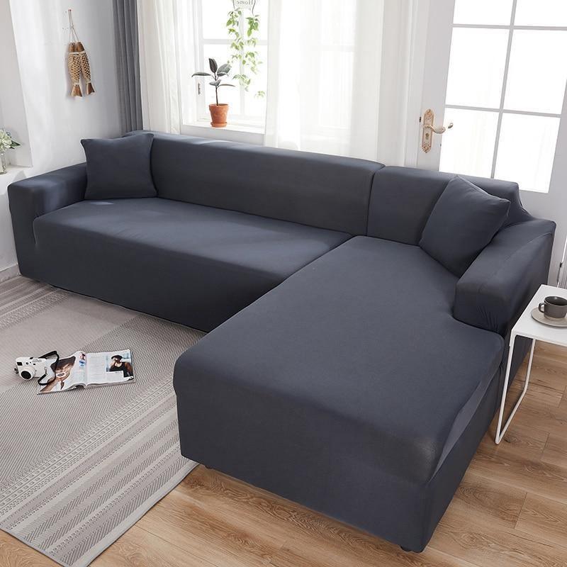 Clay grey L-shaped sofa cover on a sectional couch with a chaise.