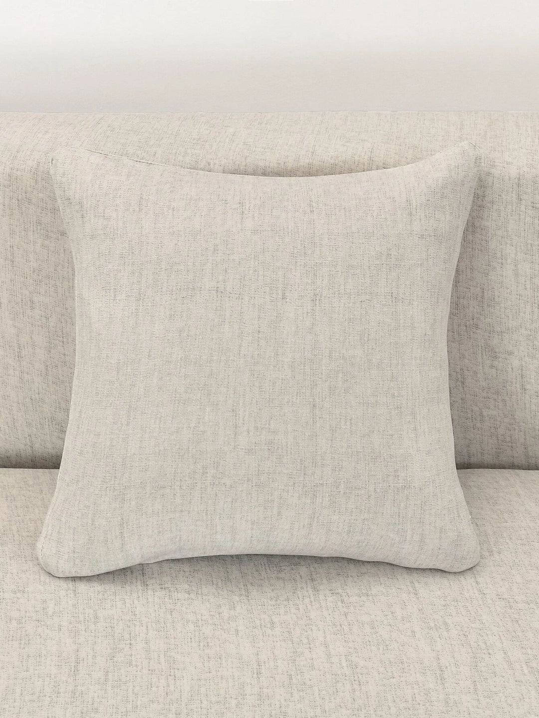 Egg shell colored L-shaped sofa cover with a subtle cross-weave pattern.