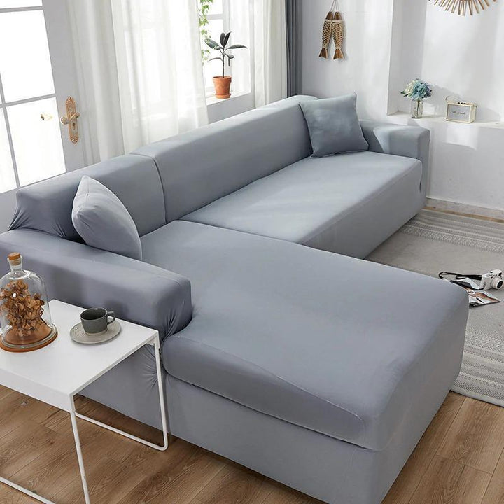Mouse grey L-shaped sofa cover made of soft micro-fabric on a sectional couch.