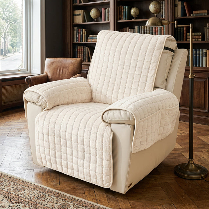 Cream quilted recliner chair cover with a non-slip fit and side pocket.