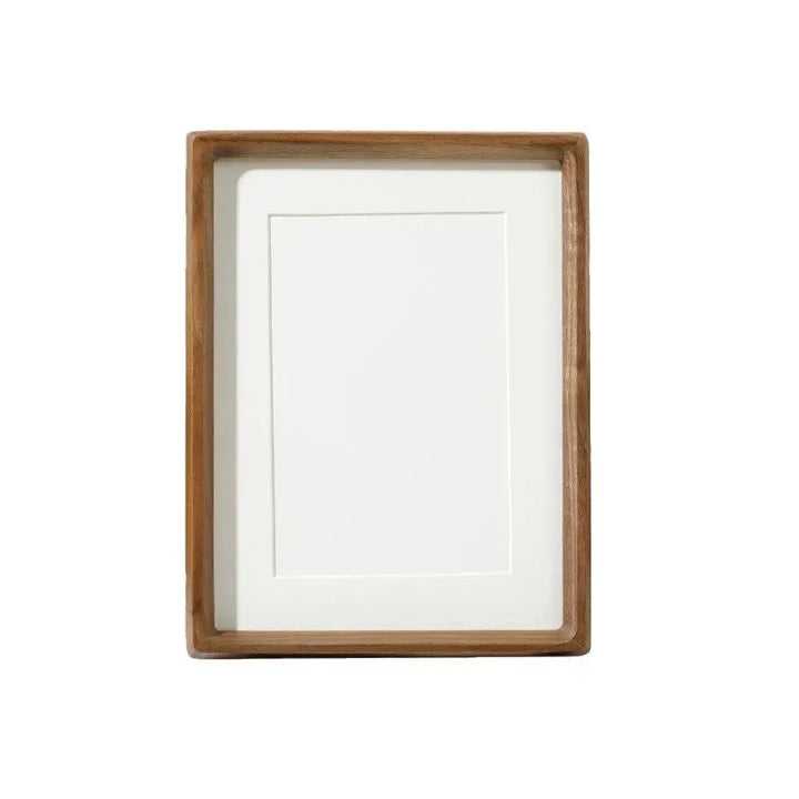 Handcrafted solid wood photo frame with a natural finish and a white mat.