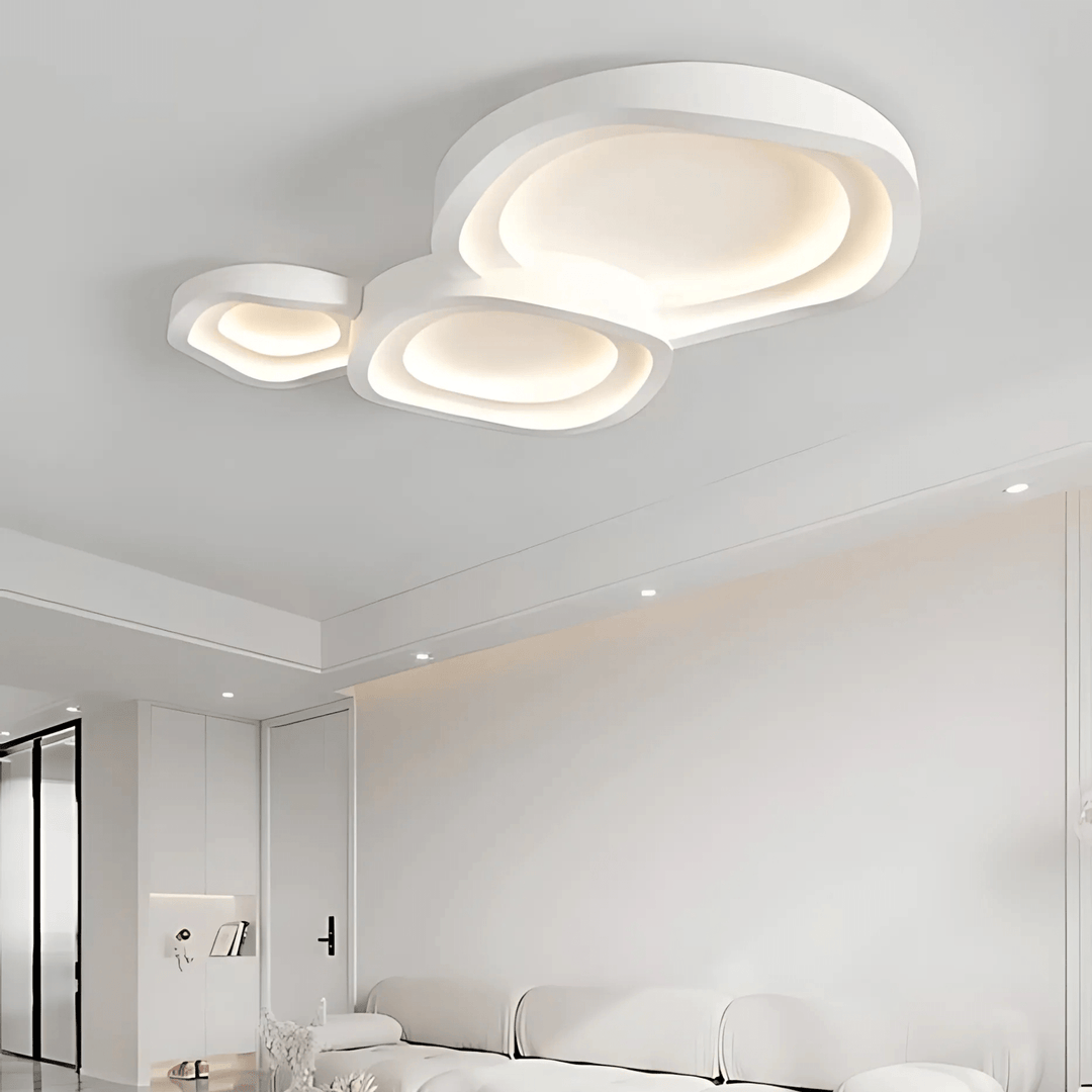 Modern white multi-tiered abstract ceiling light fixture with integrated LED illumination.
