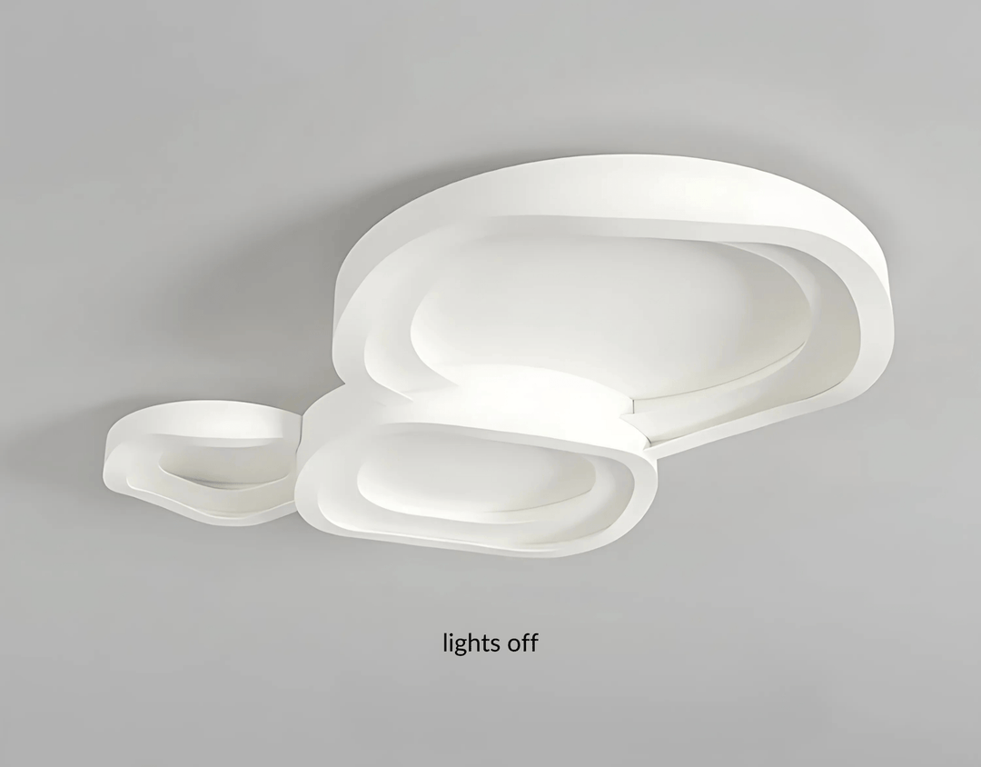 Modern white ceiling light with layered, organic shapes and integrated LED lighting.