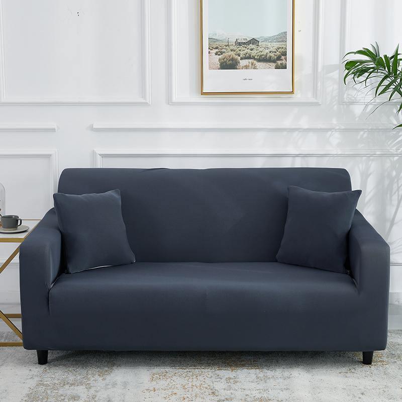 Clay grey adaptable couch cover on a sofa with two matching pillows.