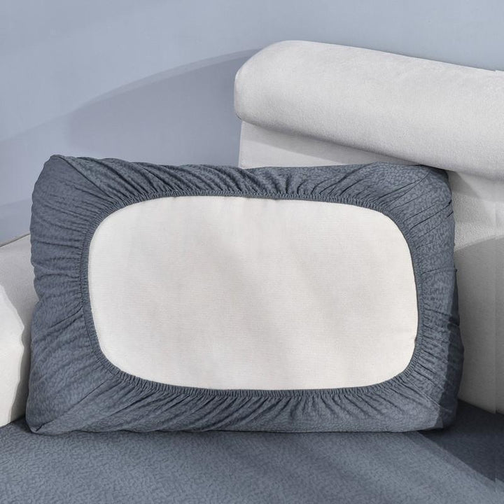Dark grey waterproof sofa cushion cover with a textured pattern and elasticized edges.