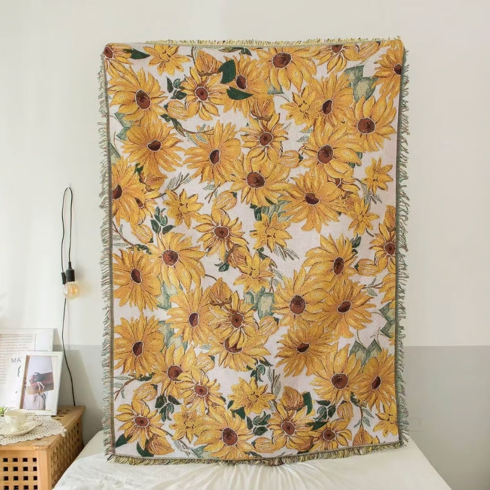 Floral picnic blanket with a jacquard weave pattern of sunflowers.
